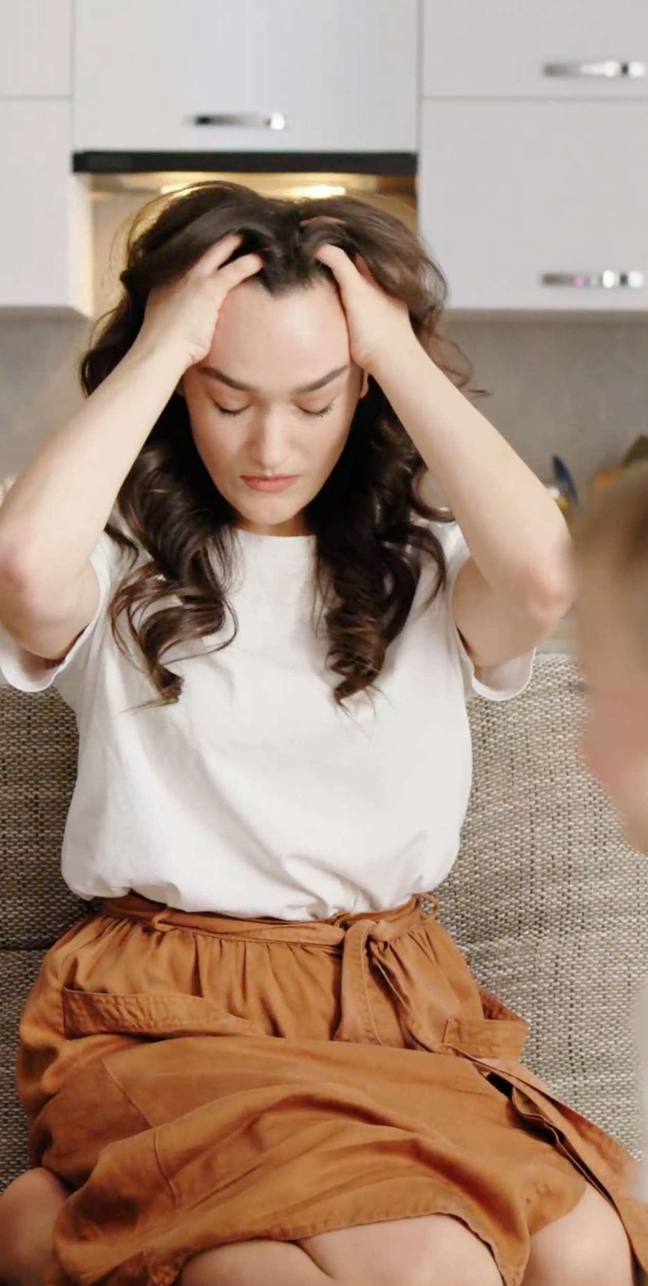 Frustrated woman with her hands in her hair